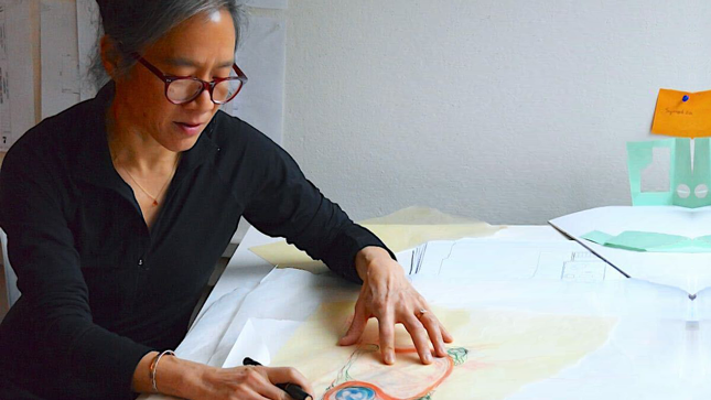 Urban designer Suenn Ho crafting a work on paper.