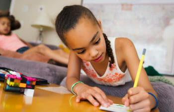 A young girl drawing