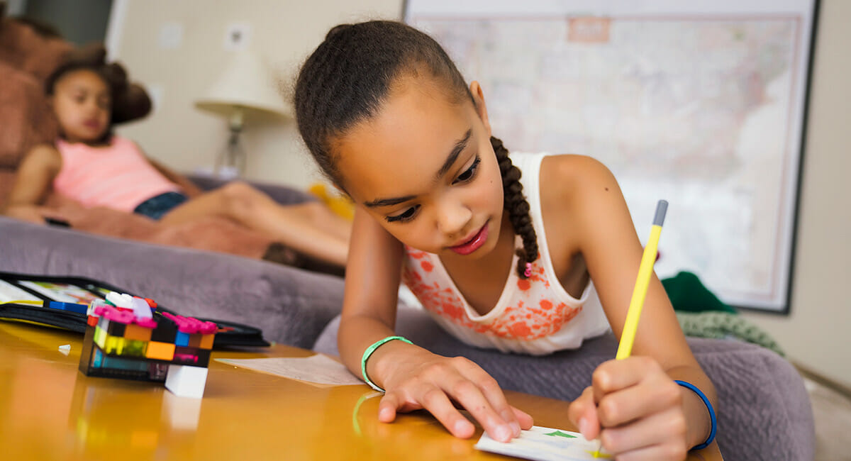 A young girl drawing