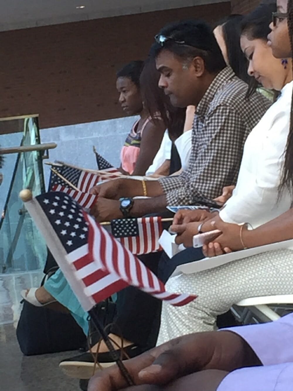 Four people seated with American flags