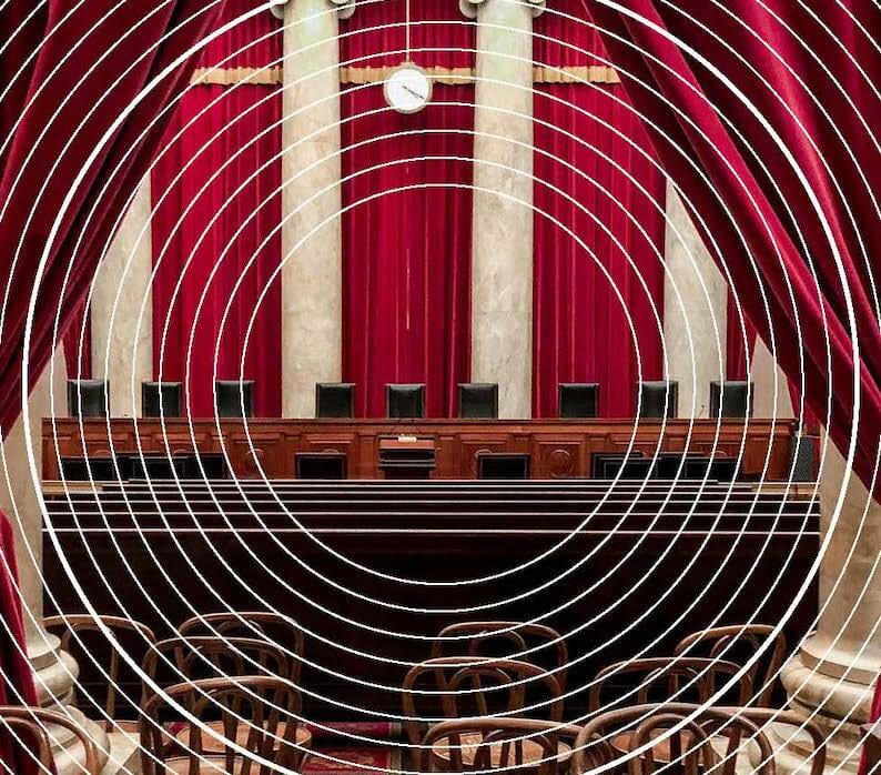 Court room with red accents with white circles overlaid 