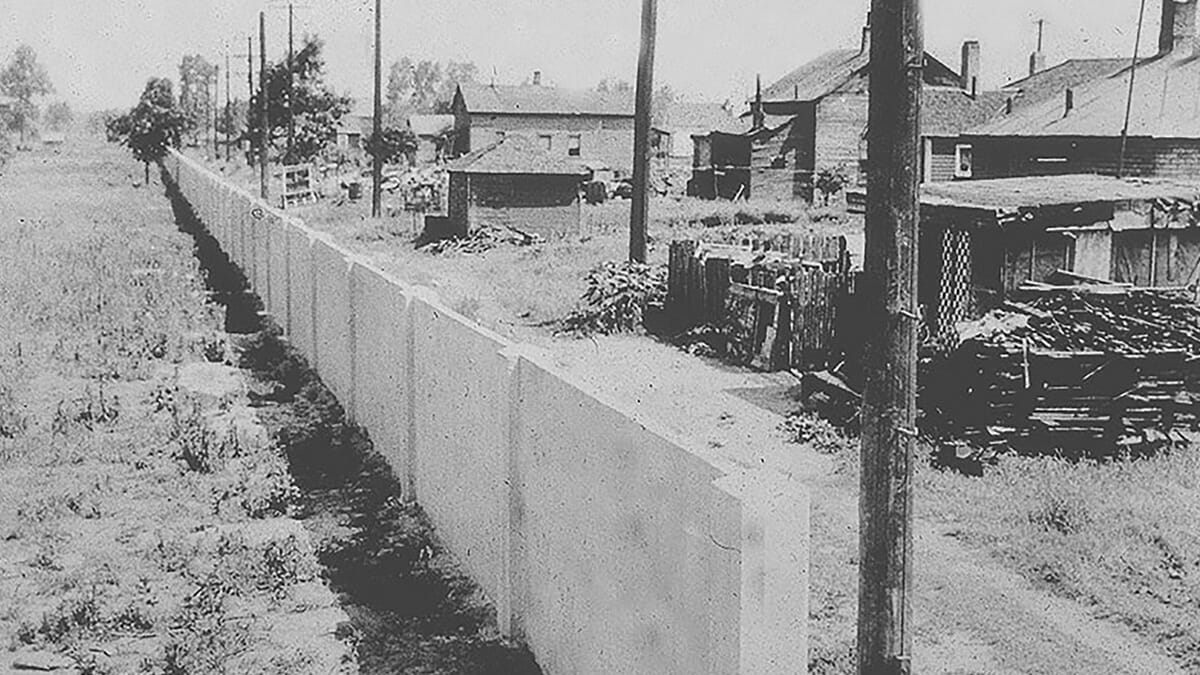 A section of the Birwood Wall showing the seperation of the Black neigfhborhood on the right from the proposed White development on the left.