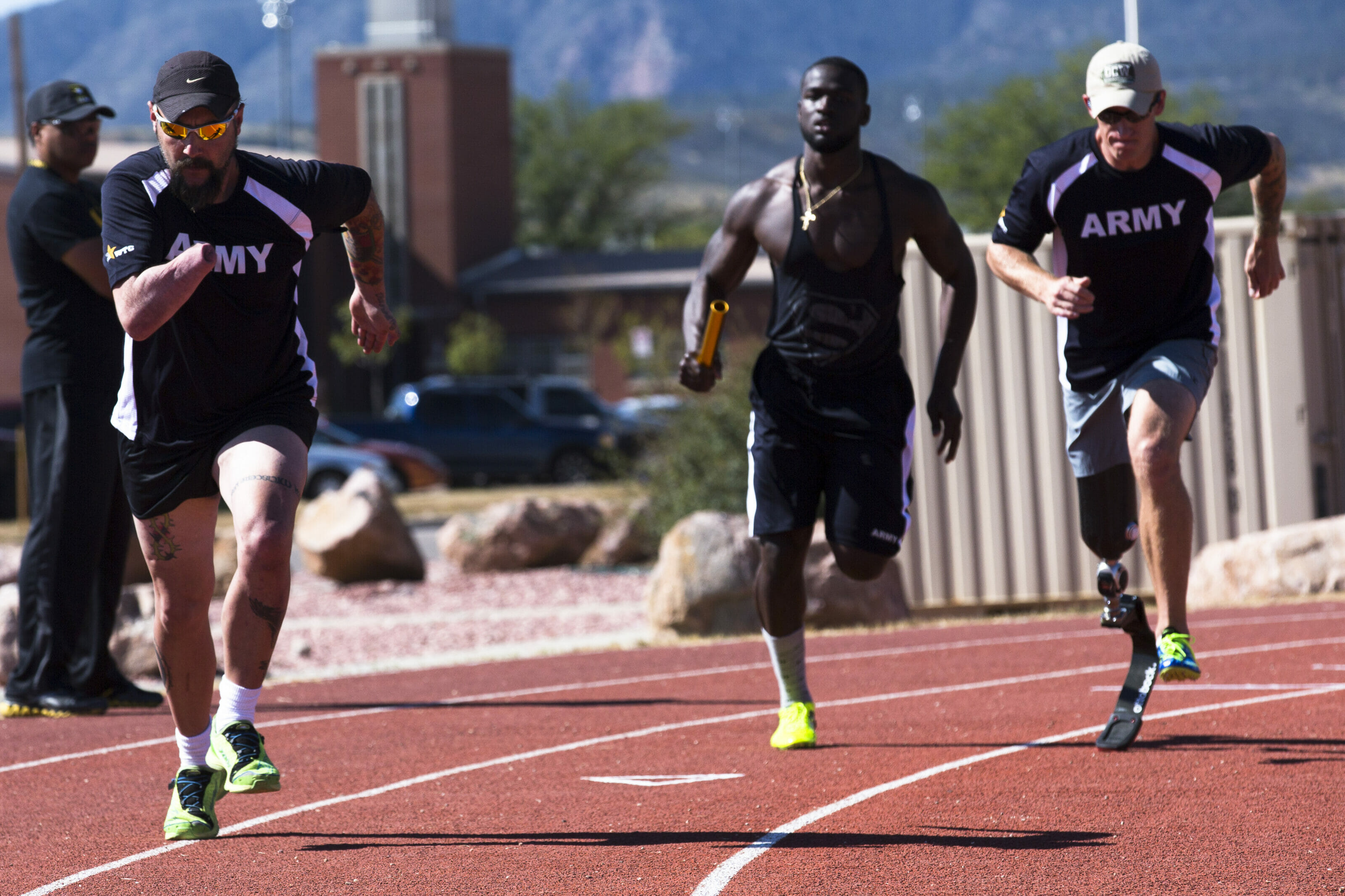 U.S. Army retired Sgt. 1st Class Andrew McCaffrey, a member of the Army team, trains on receiving the baton during the teams relay event for the 2014 Warrior Games at Fort Carson, Colo., Sept. 24, 2014. More than 200 service members and veterans participated in the 2014 Warrior Games, Sept. 28 - Oct. 4, an annual event held in Colorado Springs, Colo., in which wounded, ill and injured compete in various Paralympic-style events.  (U.S. Army photo by Spc. Elliott Banks/Released)