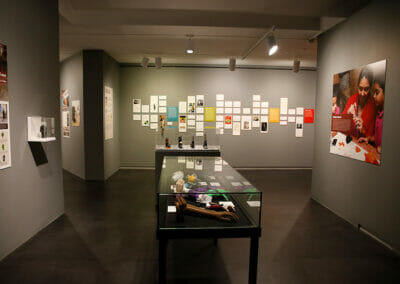 Exhibition Installation with display of prosthetic hands in the center of the room.