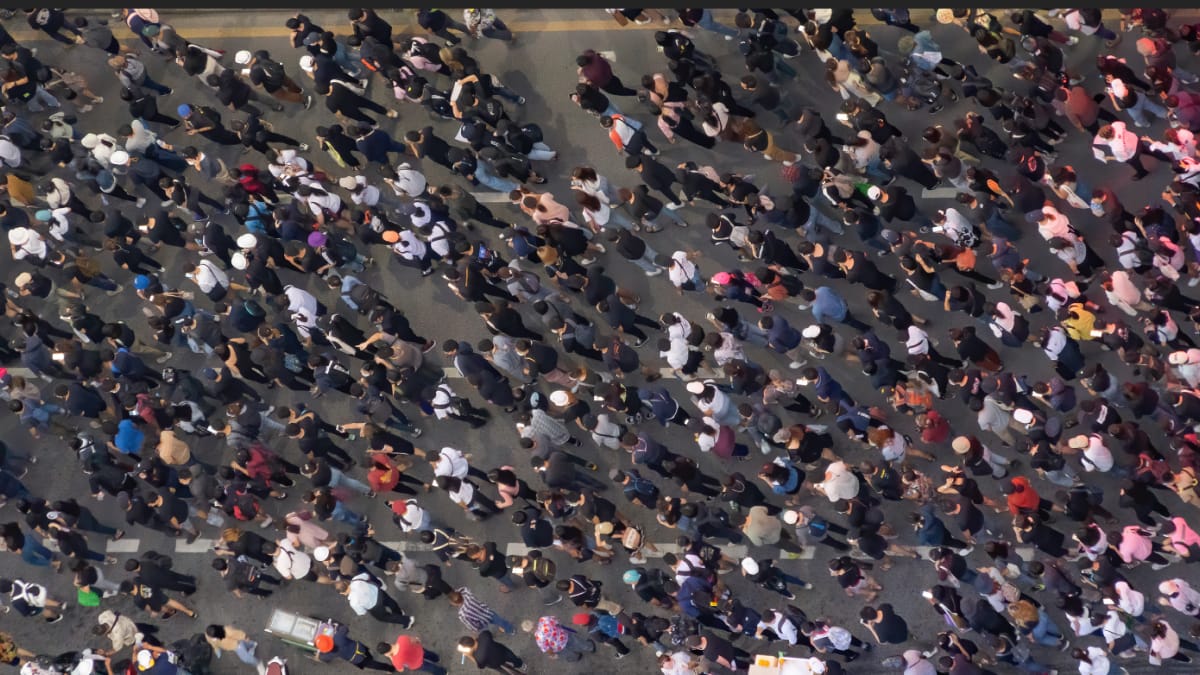 Diverse group of High School students work together on a design project.