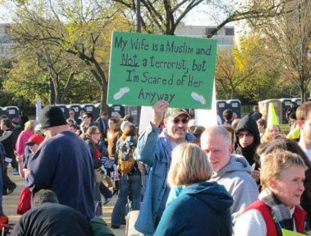 Man carrying sign at a protest